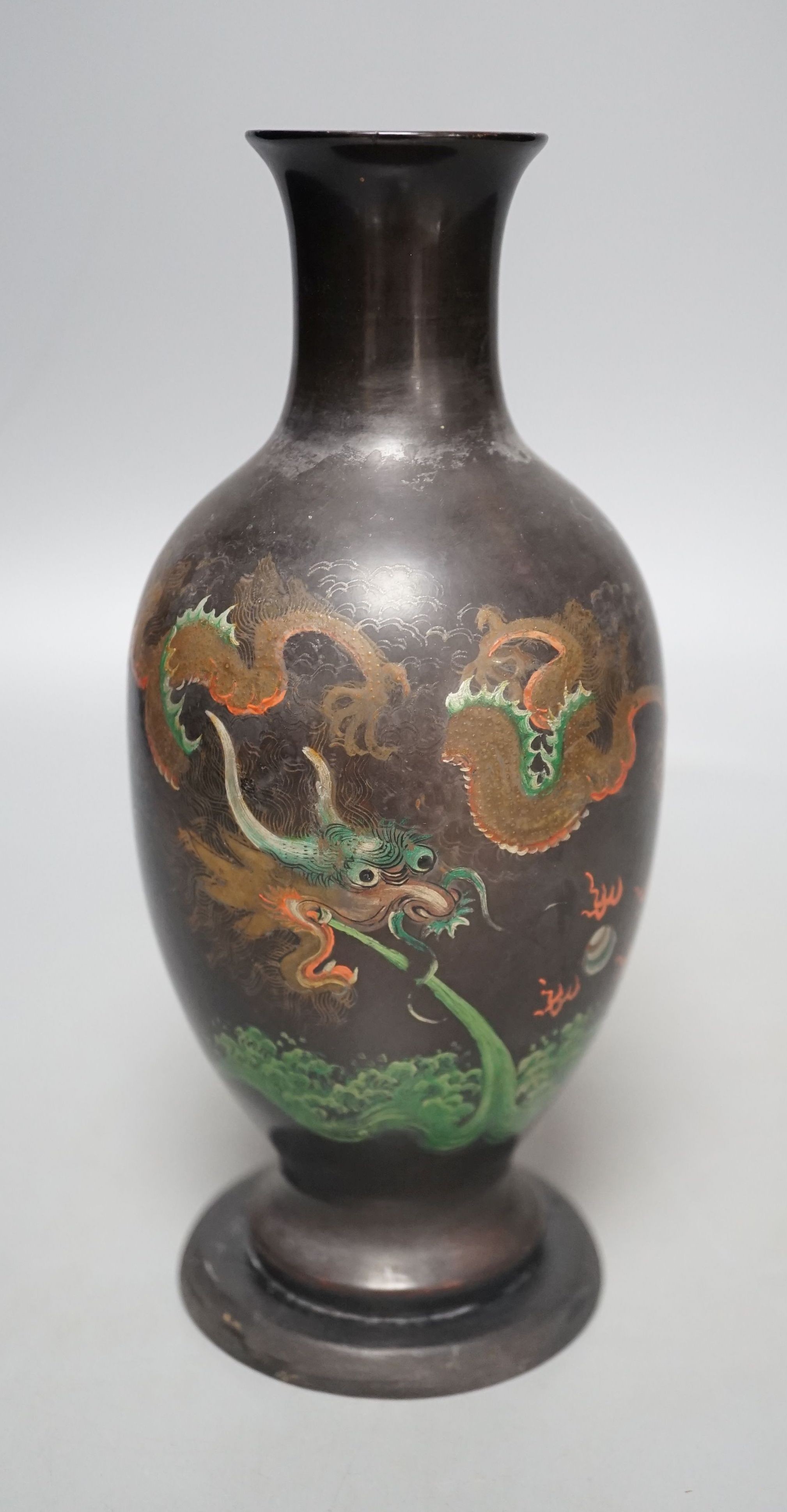 A Chinese Fuzhou lacquer papier-mâché dragon design vase, 20.5 cms high.